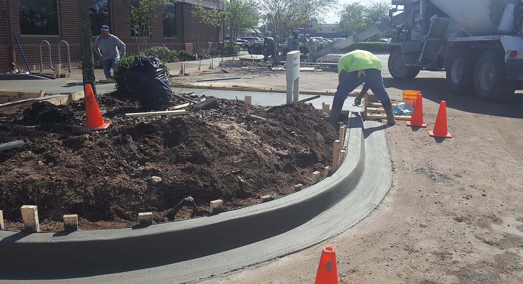 Commercial sidewalk, curb and accessible transition at a building entrance